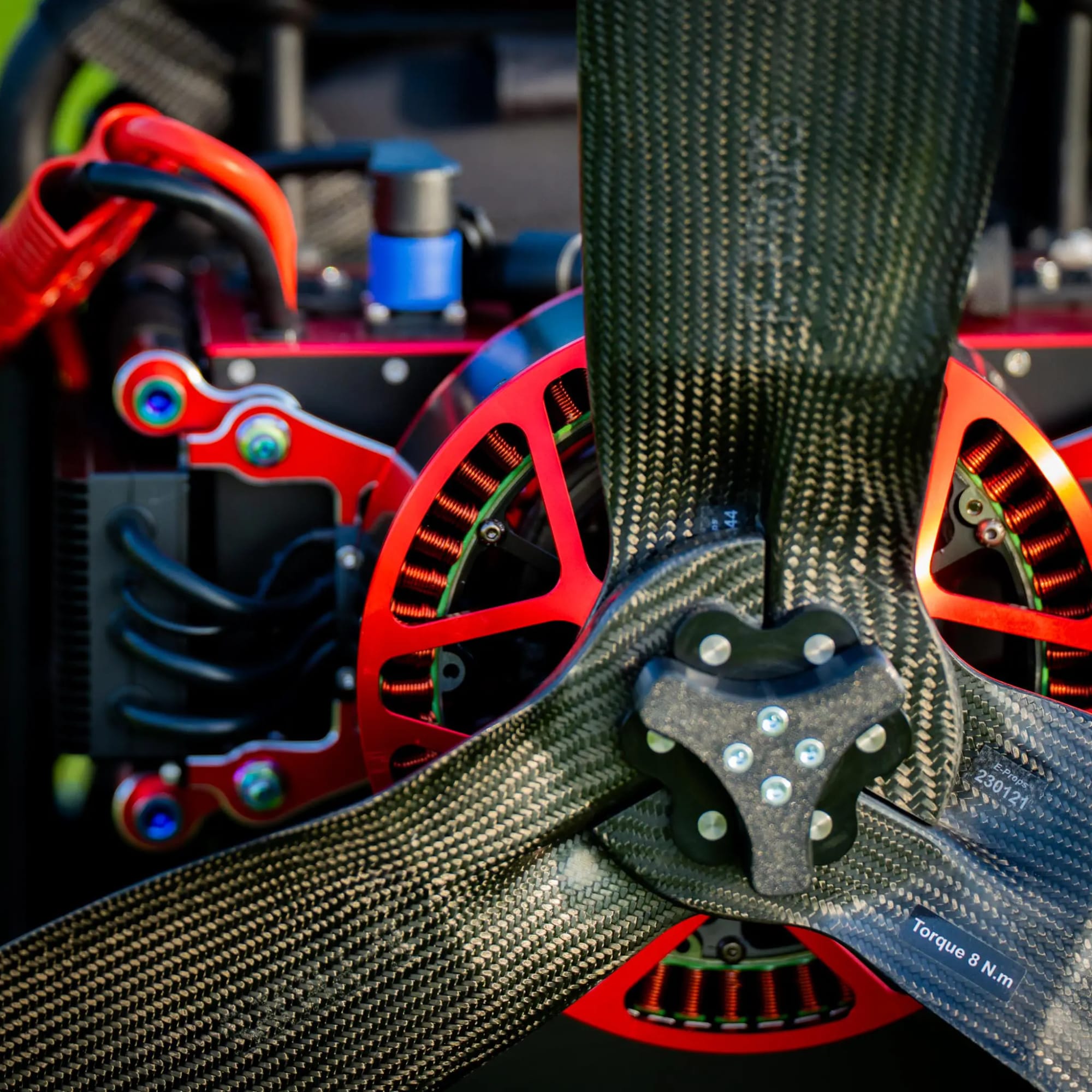 SP140 V2.5 Electric paramotor — carbon fiber frame and red anodized hardware
